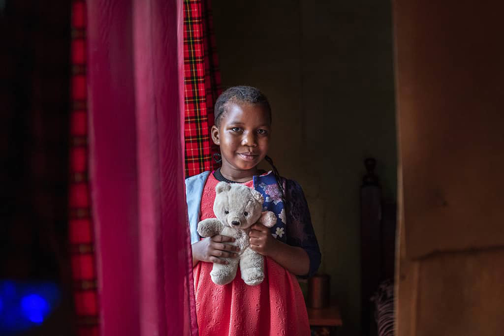 Kenyan girl with teddy