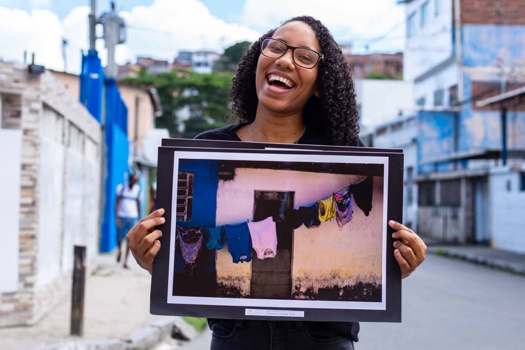 Rayane holds a photograph