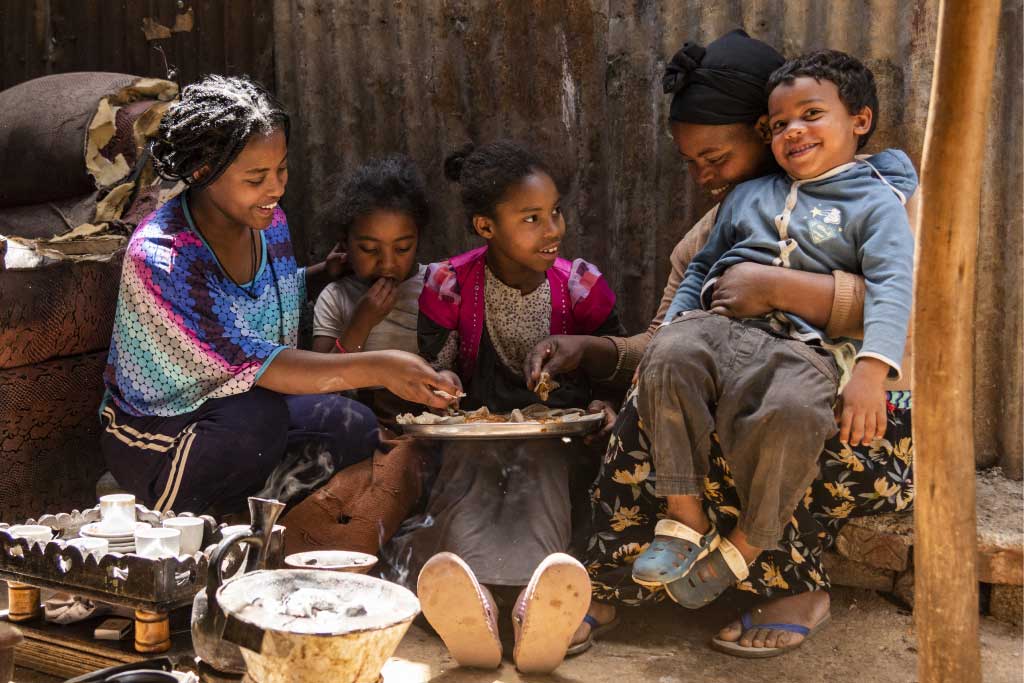 Abiyot, Ethiopia and her children gather to eat