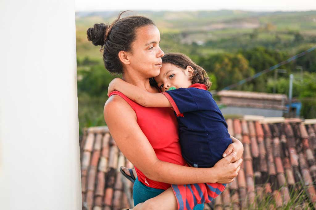 Carla holds her son, Gustavo