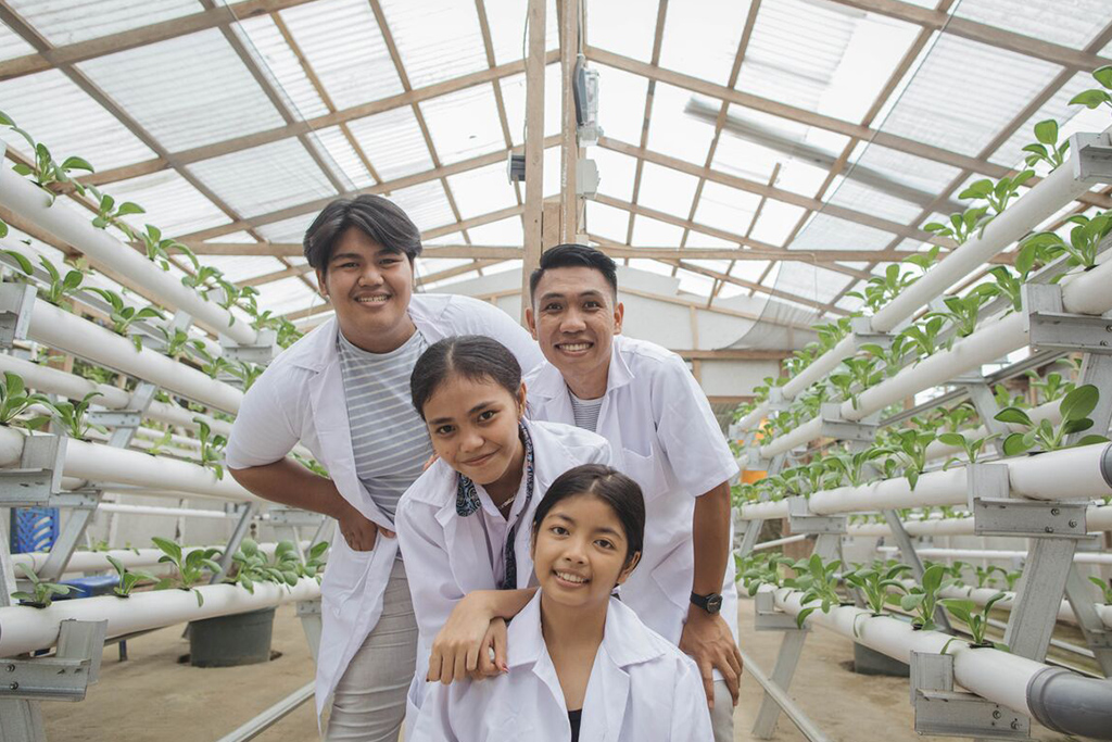 Some of the students that tend to the hydroponic garden