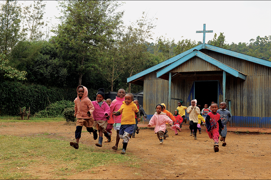 Children running outside the church.