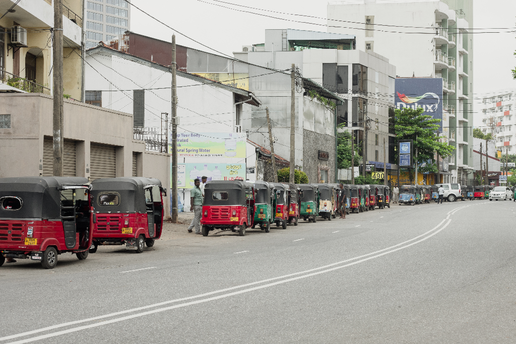 Vehicles in Sri Lanka are lined up in the street waiting to get fuel.