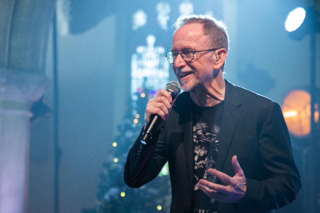 Graham Kendrick singing at the Carols with Compassion concert